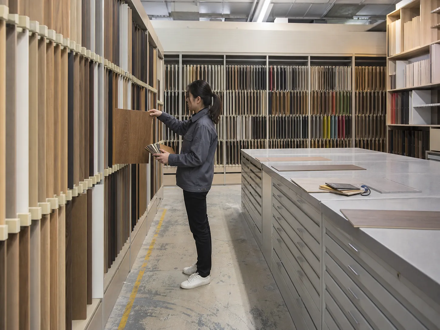 Organized sample and pattern library with pull-out panel racks and color swatches