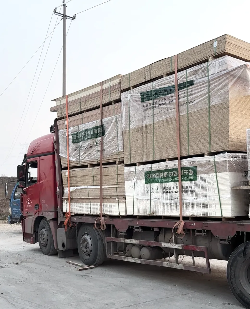 Truck loaded with wrapped wood panels for shipment
